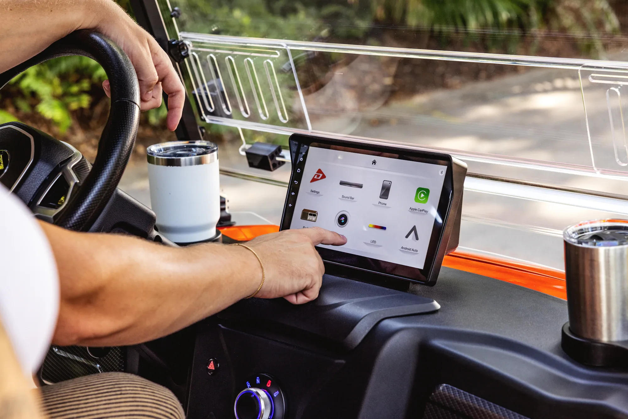 Driver using a dashboard-mounted tablet during their operation