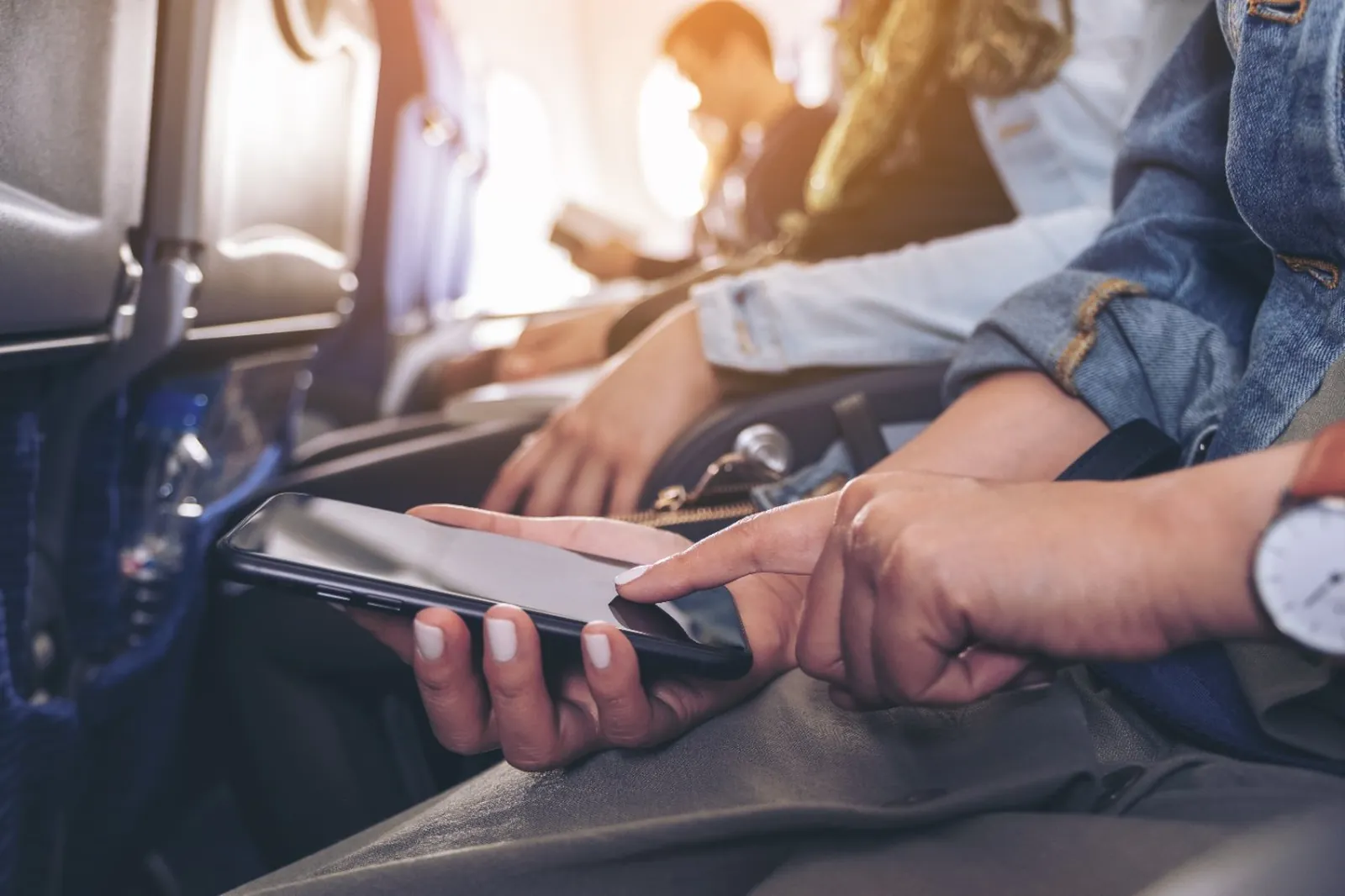 Customer requesting transportation from her phone while travelling